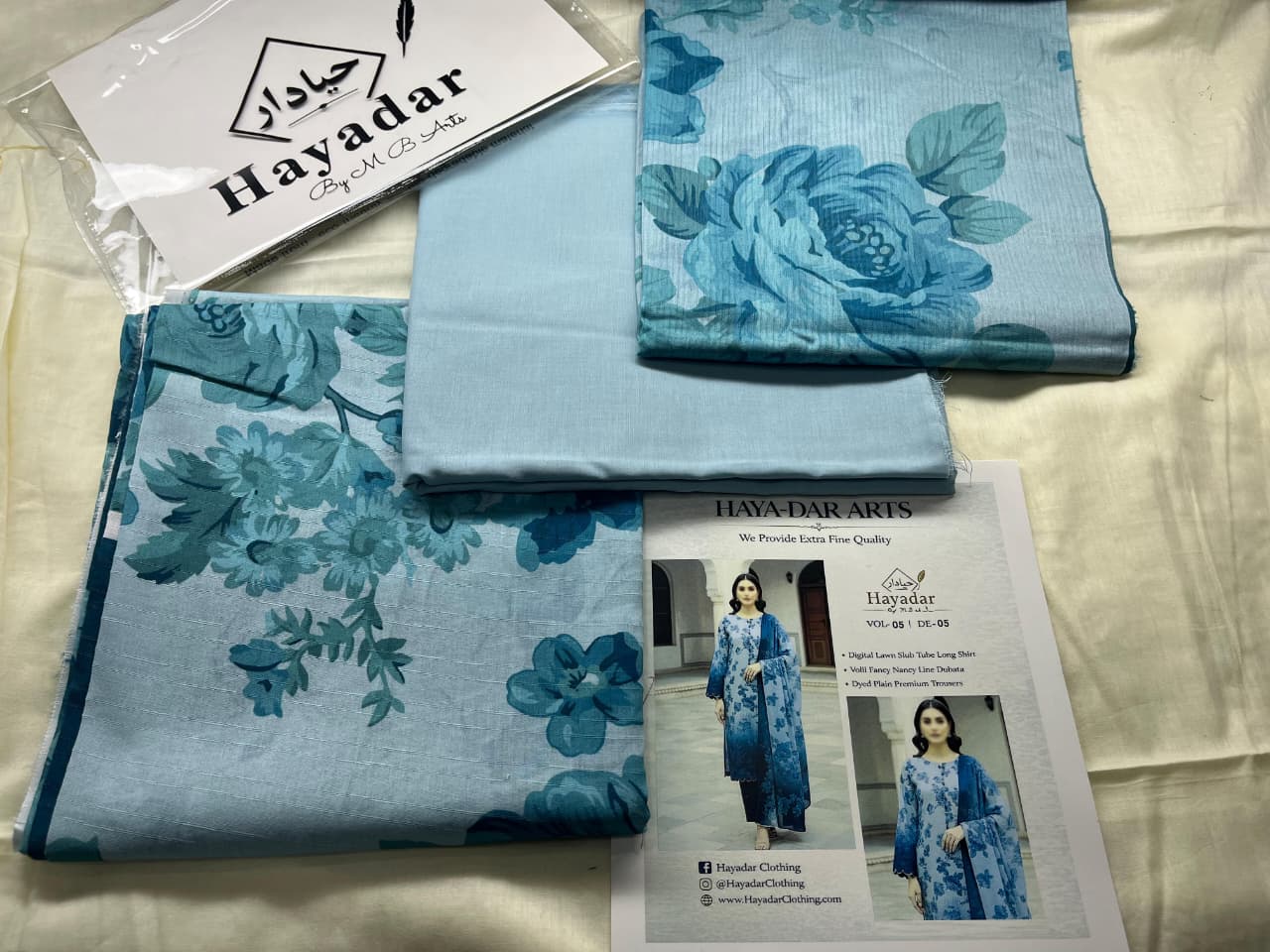 Aqua blue 3-piece premium lawn suit by Hayadar Clothing featuring rice slub fabric with a sheer voil dupatta.